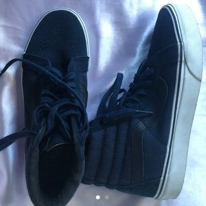 Blue and black high top Vans